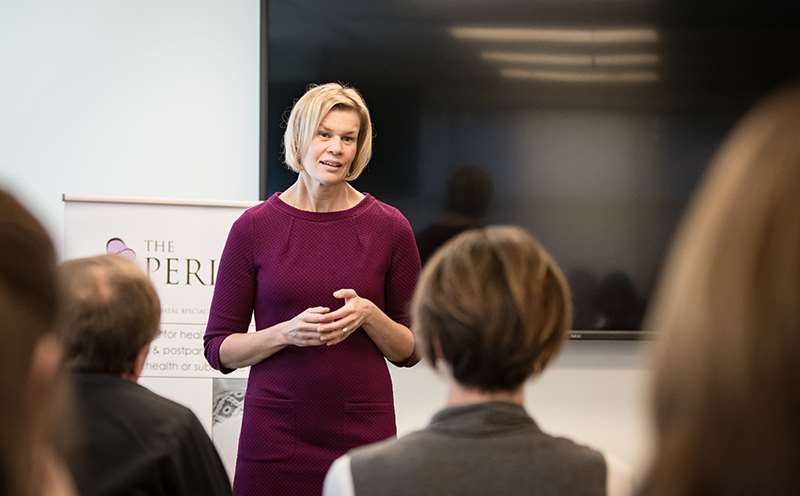 Woman standing in front of conference room