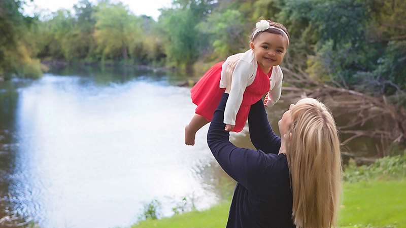 Woman holding toddler
